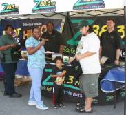 Ellis from the Z88.3 Morning Show and Tim Wolf enjoying a pizza lunch with Z88.3 fans at the Winter Garden Centra Care.