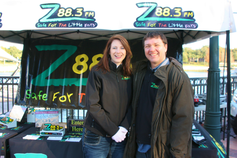 Melony McKaye Z88.3 Middays and Tim Wolf keeping warm and greeting Z88.3 listeners as walkers register.