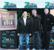 Tim Detellis and Dave Nowak from New Missions with Tim Wolf from Z88.3 greeting Z88.3 listeners and walkers as walkers register.