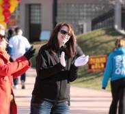 Christine Webb and Melony, cheer on walkers as they cross the finish line.