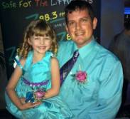 Father daughter Z88.3 listeners stopped by the Z88.3 table to say hi.